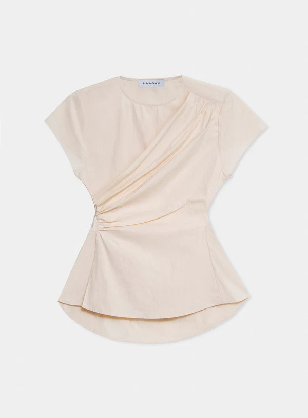 Beige top with a draped design on a white background