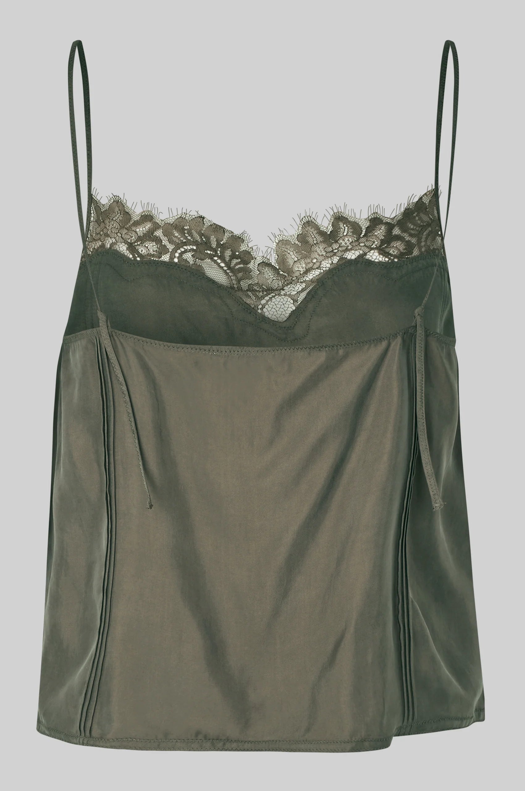 Green satin top with lace trim on a gray background