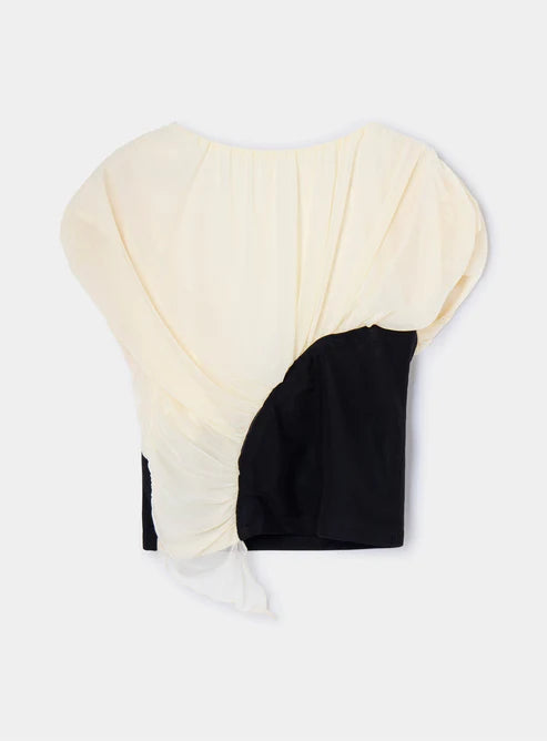 Black and beige color block top on a white background