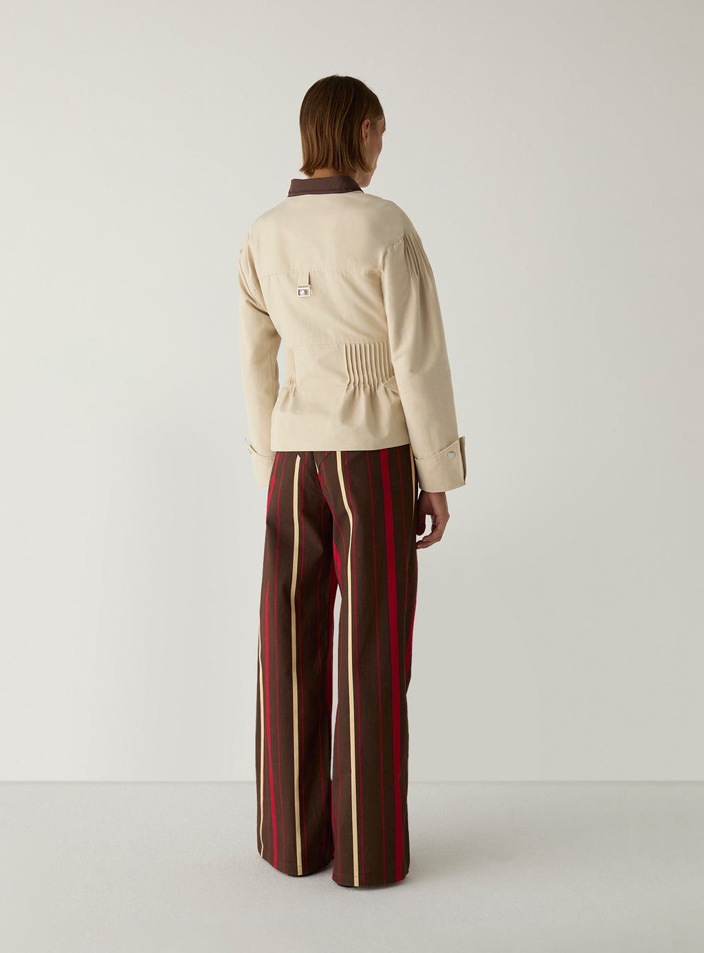 Woman wearing the Orly Ecru Serge Jacket by LAAGAM